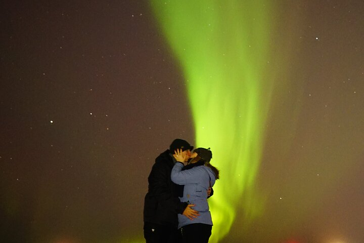 Couple under the aurora borealis