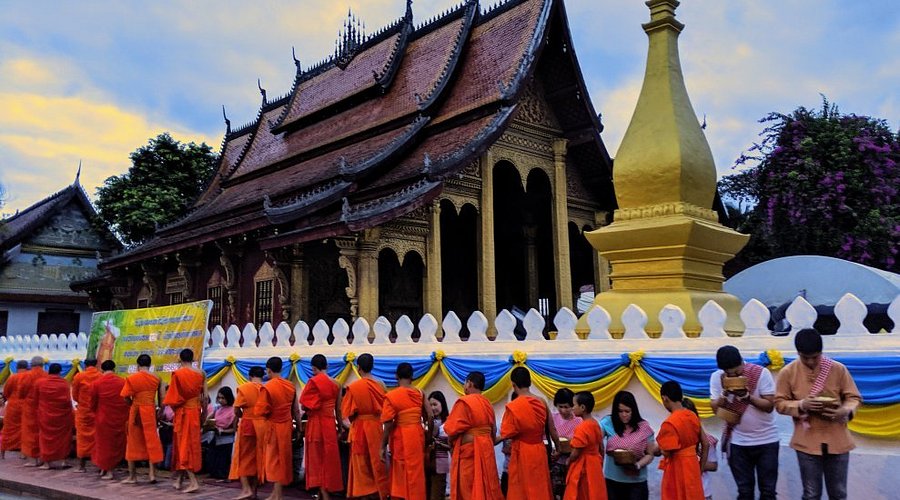 Monks participating in the alms giving ceremony at dawn