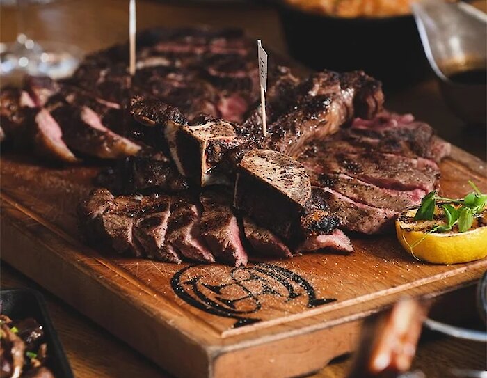 A hiker with crampons walks through Johnston Canyon with ice formations
