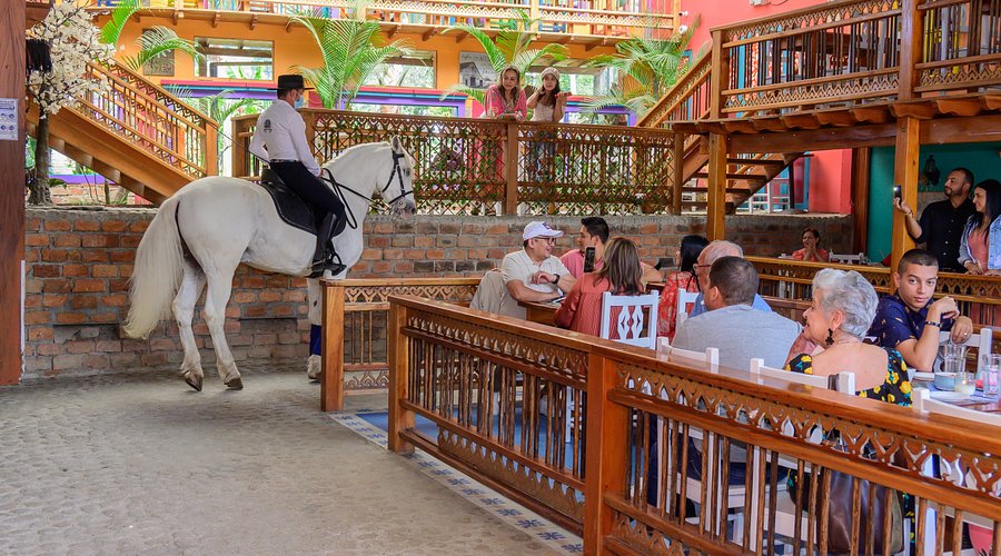 Medellín skyline at sunset from a rooftop bar