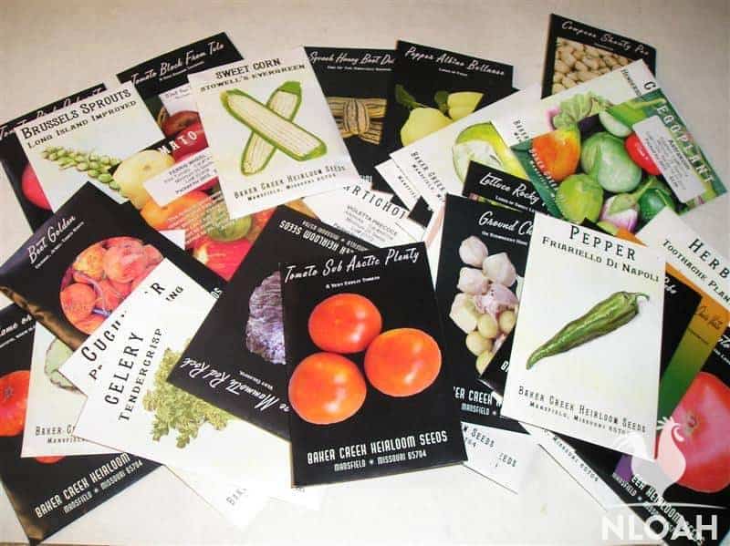 row seed packets labeled heirloom variety