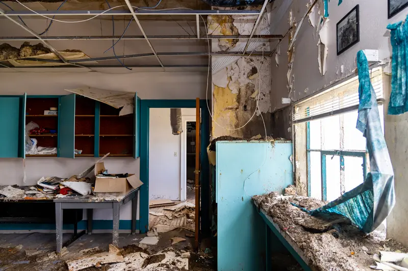 A close-up of graffiti on a school locker, hinting at the events that transpired before the apocalypse.