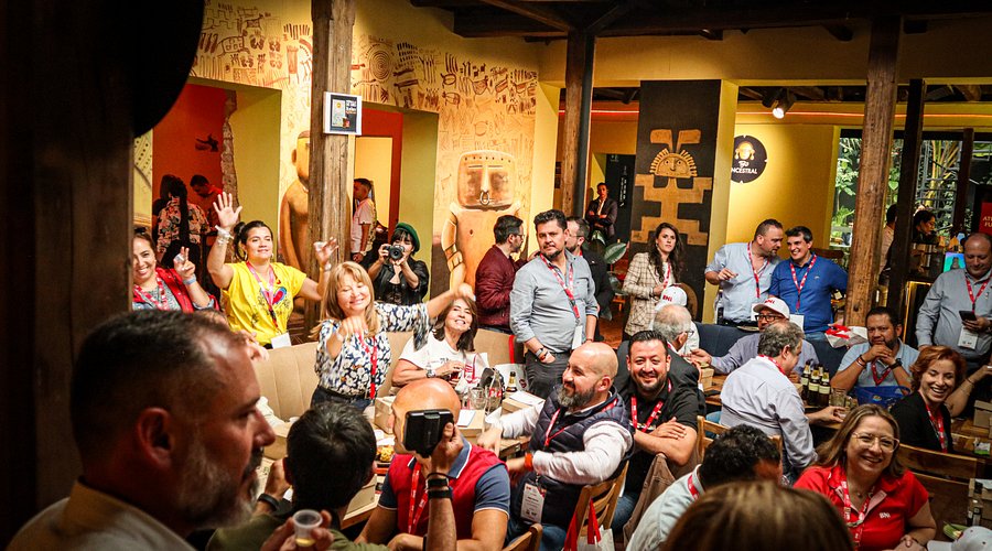 A plate of Bandeja Paisa with rice, beans, meat, avocado, and a fried egg