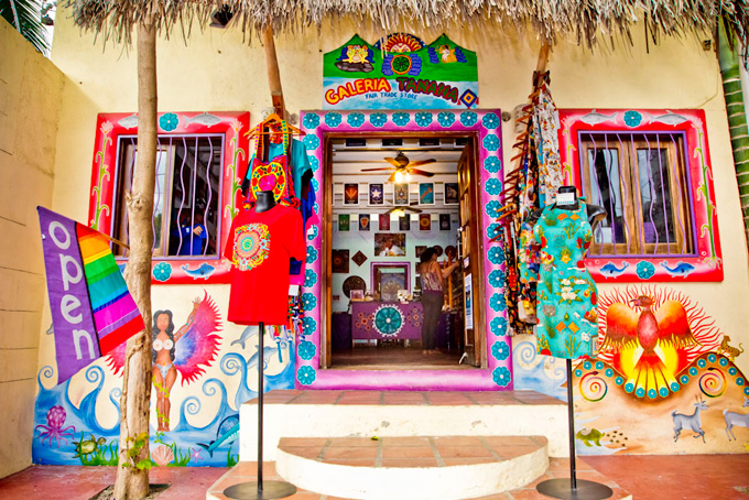 A Greek musician plays the bouzouki by the Aegean Sea in Sifnos, Greece.