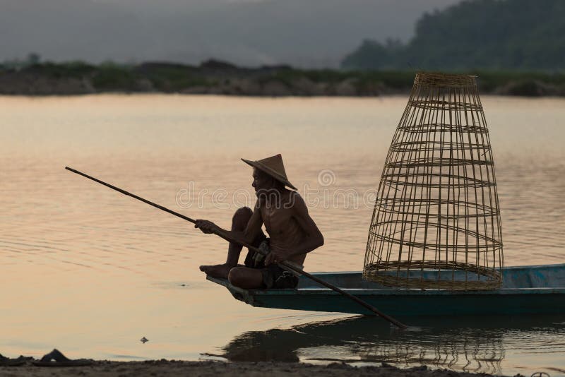 The cascading water of Kuang Si Falls, captured with a long exposure to create a sense of movement and serenity
