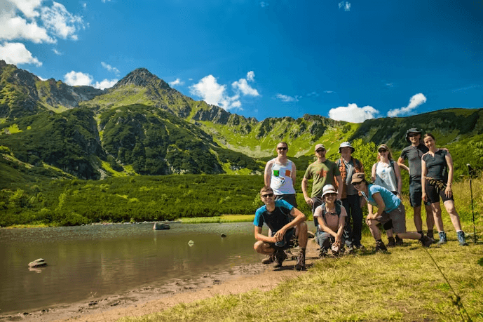A scenic view of the Carpathian Mountains with lush green vegetation and clear skies.