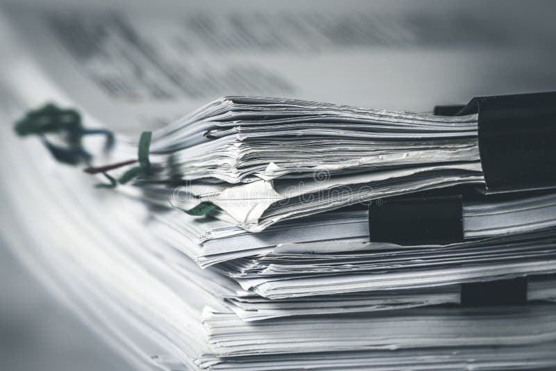 Black and white photo of a document shredder, symbolizing the destruction of evidence.