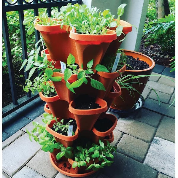 A detailed shot of copper tape applied around the base of a pallet planter, highlighting the texture of the copper tape and the wood.