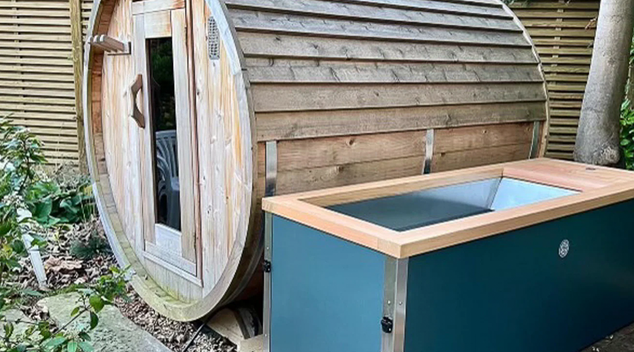 Steam billowing from the Ice Sauna, surrounded by walls of ice