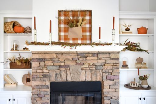 An inviting farmhouse dining table set with pumpkins, gourds, and other natural elements, creating a cozy and festive atmosphere for autumn meals, demonstrating the final look of natural decor.