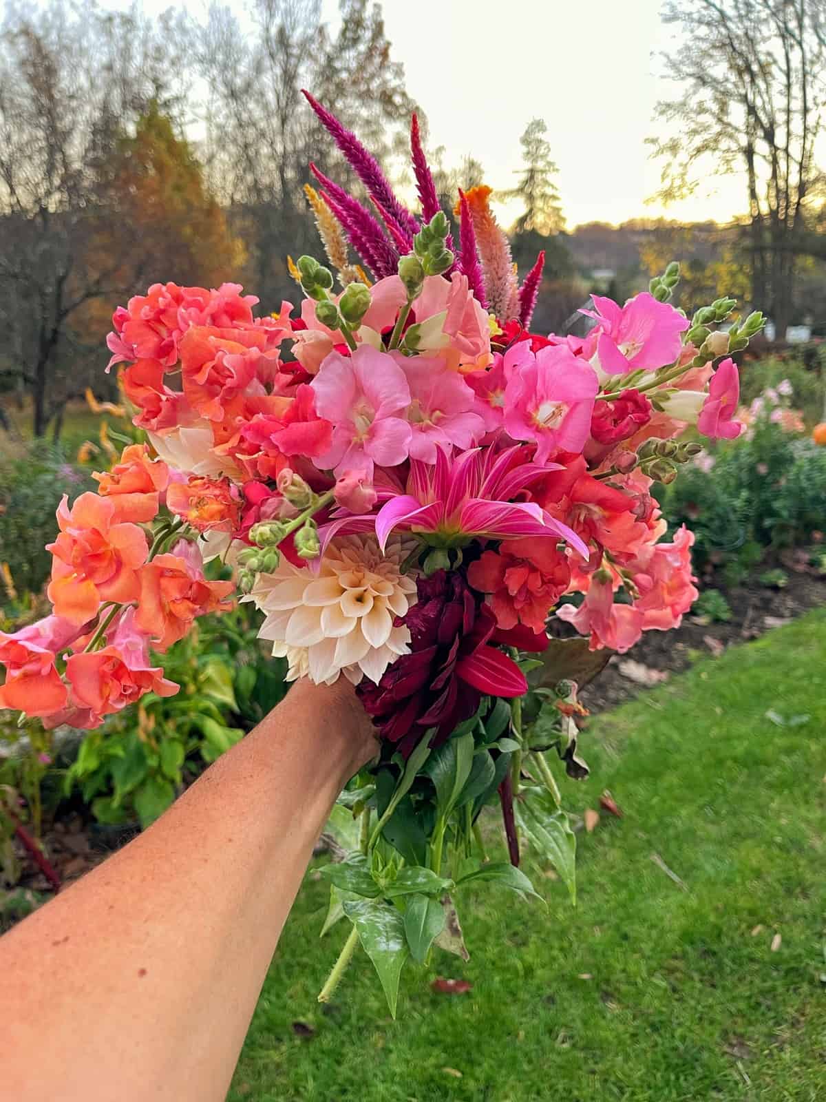 Cozy farmhouse interior with a vase of homegrown flowers on a table.