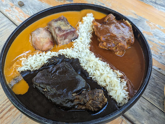 Origen's Mole Verde dish, showcasing its vibrant green color and artistic presentation.