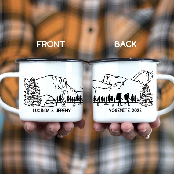 Close-up of a Stellar's Jay perched on a branch, showcasing its vibrant blue and black plumage. Alt text: A Stellar's Jay, with its striking blue and black feathers, poses on a branch within Upper Pines Campground, a favorite birdwatching spot for George and Martha.