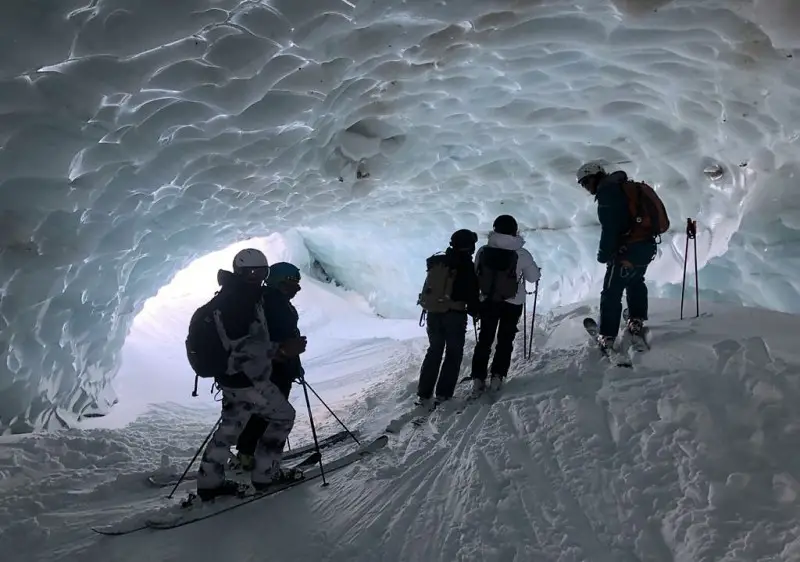 Backcountry skiing showcasing a steep, snow-covered slope.