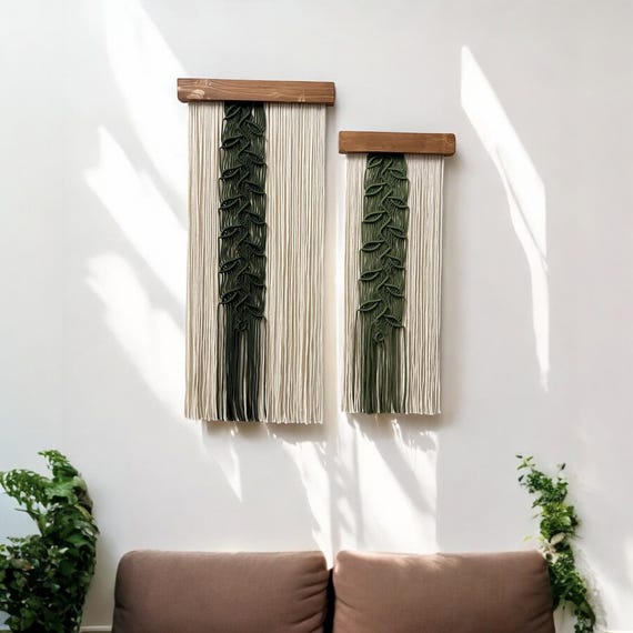A close-up of a cream-colored linen throw blanket draped over the arm of a light grey linen sofa. The texture of the linen is visible, adding depth and visual interest.