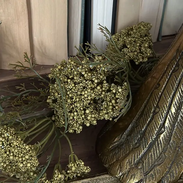 A decorative green garland made from queen anne's lace.