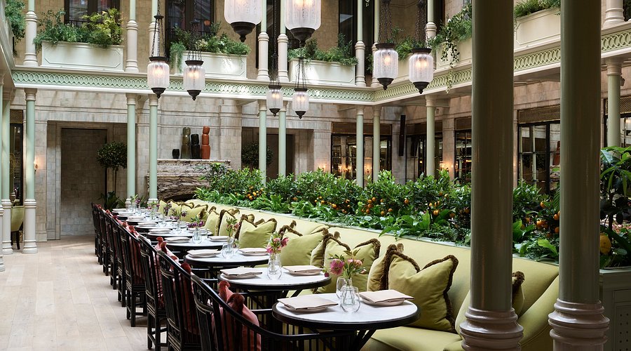 The NoMad London exterior at night, showcasing its elegant architecture and prime location