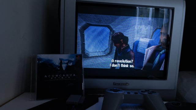 Clean, minimalist photo of the assembled PC inside the Cooler Master MasterBox Q300L, positioned on a wooden desk next to a retro game console (e.g., SNES). Use natural lighting and a slightly desaturated color palette.
