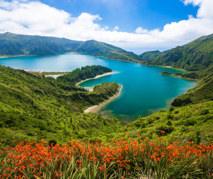 Swimmers enjoying the thermally heated ocean water at Ponta da Ferraria, São Miguel, Azores.