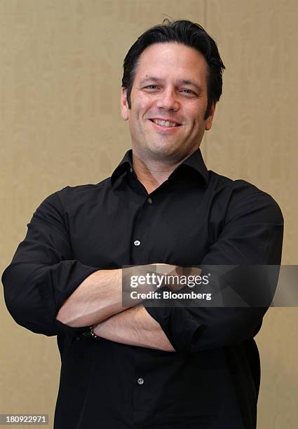 A screenshot of the Game Pass interface, featuring Avowed prominently, but surrounded by a multitude of other games (mostly casual and live-service titles) like Fall Guys and Sea of Thieves. Highlight the contrast between Avowed's RPG genre and the vibrant, cartoony aesthetics of the surrounding games.