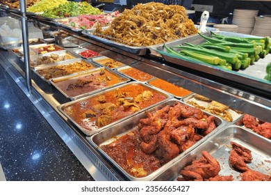 The Sisters Char Kway Teow stall at Sungai Pinang Food Court, with the sisters skillfully operating the woks amidst a cloud of flavorful steam, capturing the essence of Penang's culinary scene.