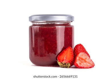 Strawberry jam in a small jar on a wooden table