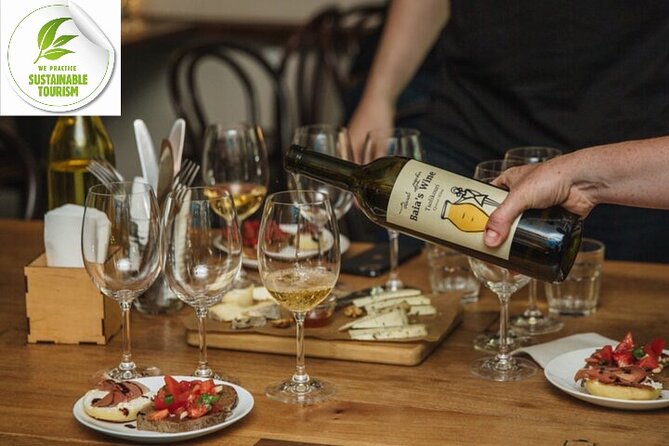 A traditional Georgian Khachapuri, a round bread filled with Imeretian cheese, is shown fresh and hot.