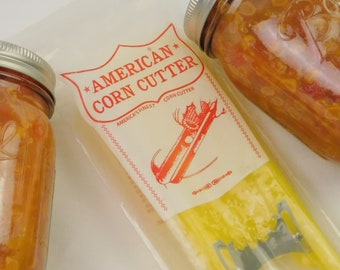 Jars of homemade canned goods in a farmhouse kitchen.