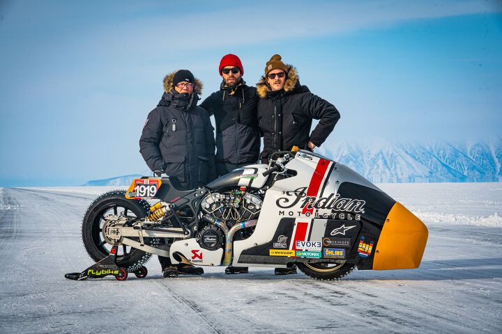 A tracking shot of a snowmobile speeding across the ice, capturing the blur of motion.