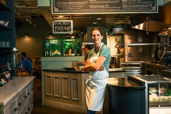 People gathered in a park drumming and dancing at sunset, capturing the vibrant energy of the Pritchard Park drum circle. The alt text describes the communal experience and festive atmosphere of the event