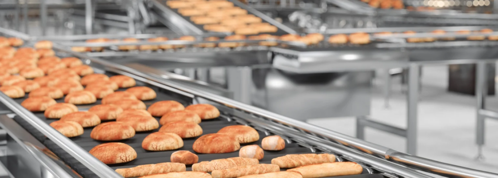 Close-up of a baker taking a photo of a croissant