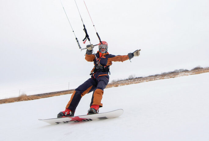 Lone figure chipping through ice on Lake Winnipeg