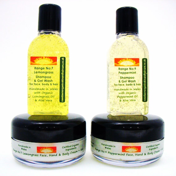 Various Suds & Soul soap bars arranged on a wooden shelf with sustainable packaging.