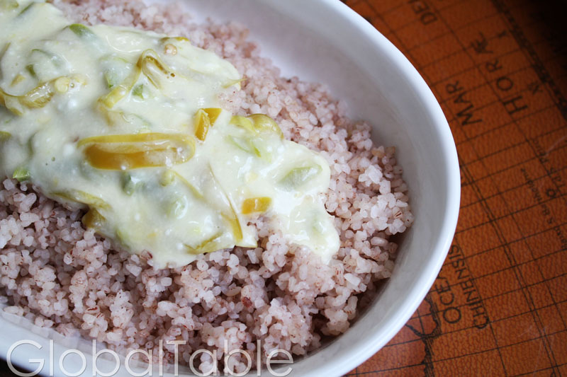 A plate of ema datshi, a traditional Bhutanese dish made with chilies and cheese