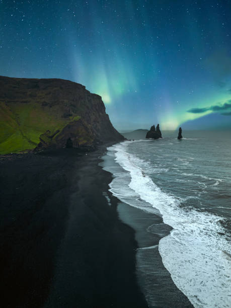 Basalt columns at Reynisfjara Beach under the Northern Lights