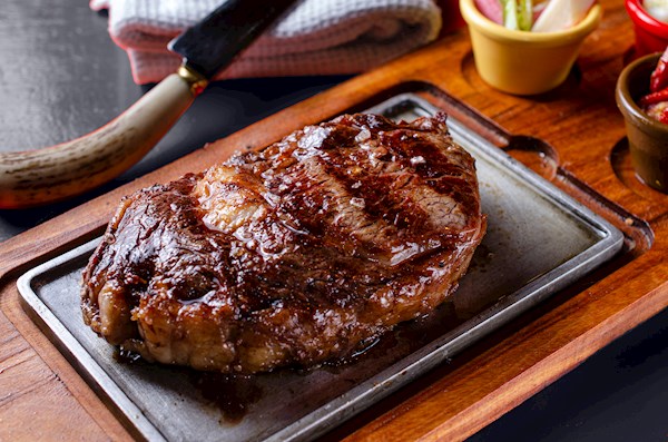 Perfectly seared bife de chorizo from Don Julio, showcasing its rustic elegance and inviting texture.