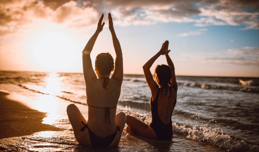 Person meditating on Shell Beach, Australia