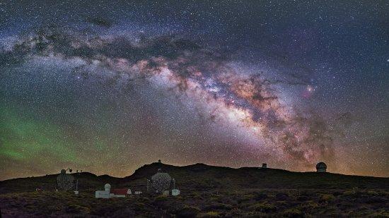 Wide shot of the Roque de los Muchachos Observatory at night with the Milky Way visible