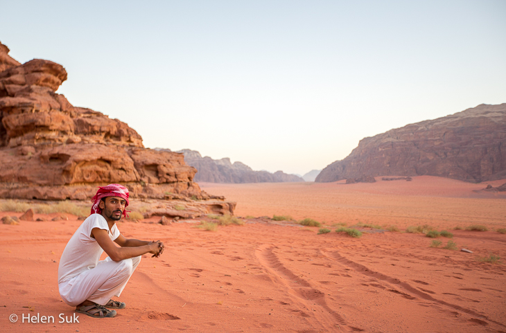 Wadi Rum's Landscape Under a Starry Night, showing expansive desert terrain and the Milky Way, using panoramic stitching to capture the vastness