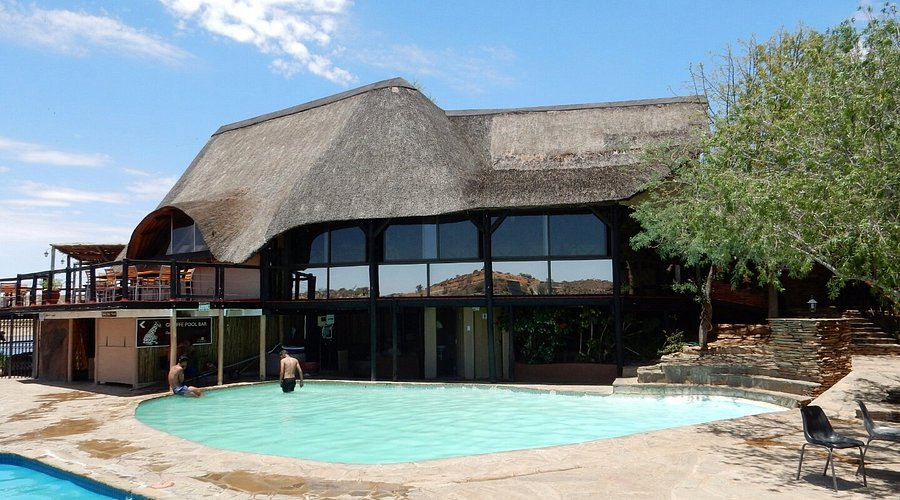 The Milky Way rises above the dead camel thorn trees of Deadvlei