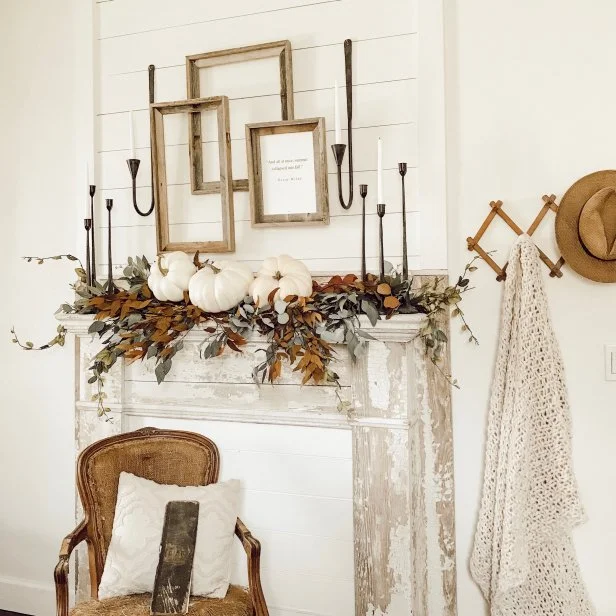 A farmhouse mantel, showcasing festive fall decorations.