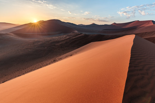 Dune 45 at sunrise, with dramatic light and shadow, HDR, f/8, ISO 100. The stillness and silence of the desert morning are palpable.