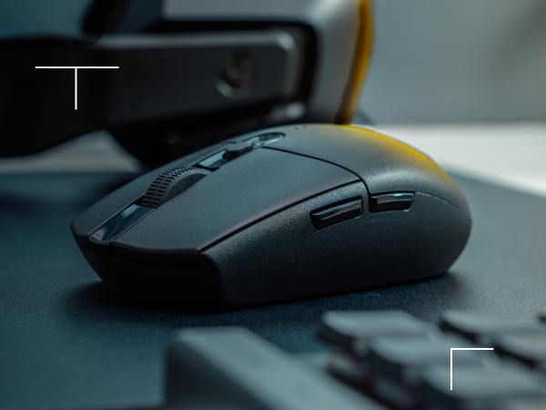 Flat-lay arrangement of the AMD Ryzen 7 7700X CPU, ASUS ROG Strix B650E-I motherboard, and Samsung 990 Pro SSD on a white surface.