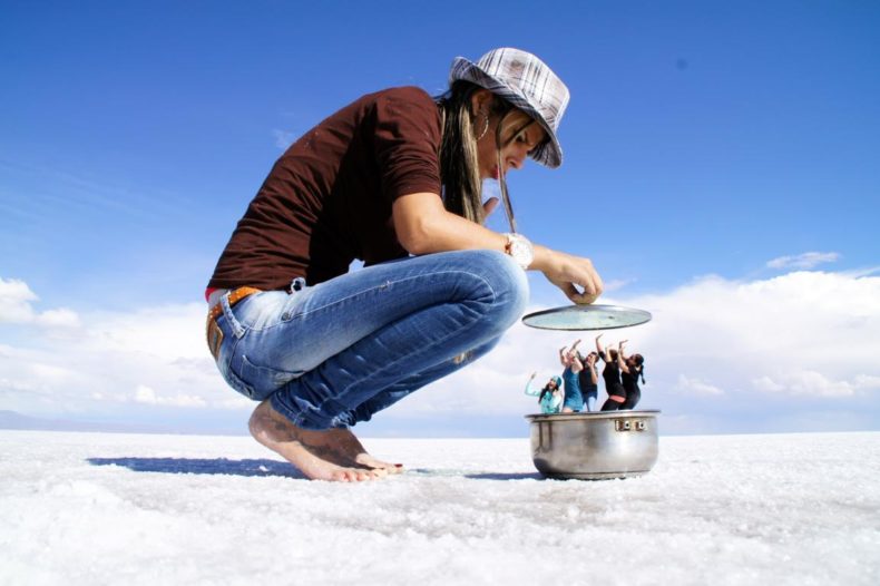 The vast, white expanse of Salar de Uyuni under a harsh sun, highlighting the need for strong UV protection.