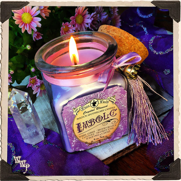Beeswax candles cooling and hardening in mason jars