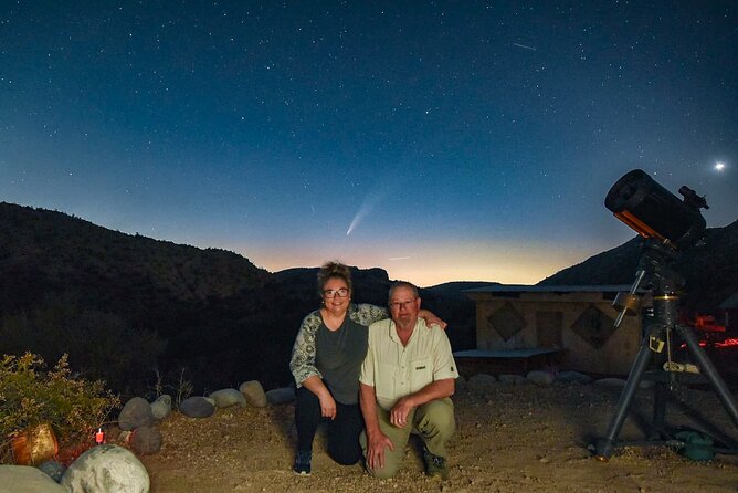 A scenic view of the Salar de Uyuni with a clear sky and a person admiring the landscape.