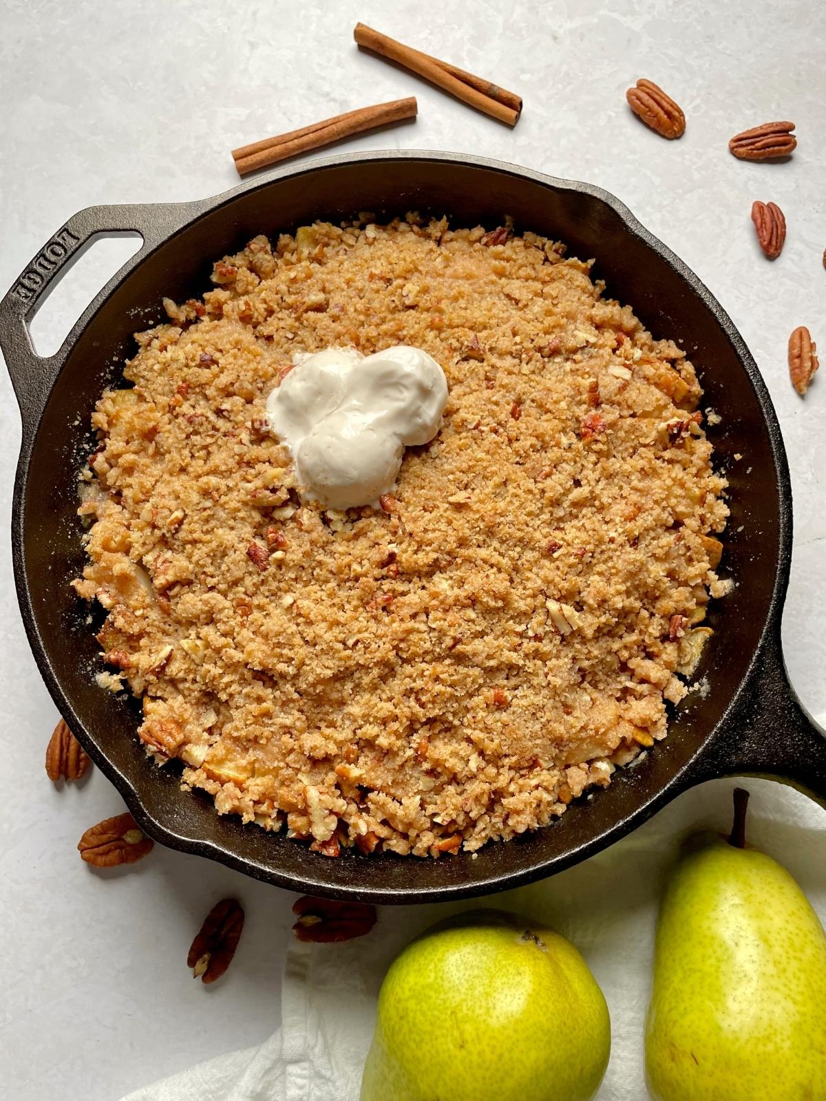 Spoonful pear cranberry crumble steam rising