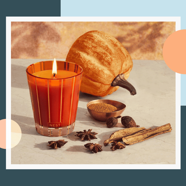 Pumpkin candles casting a warm glow, perfect for creating an autumnal ambiance.