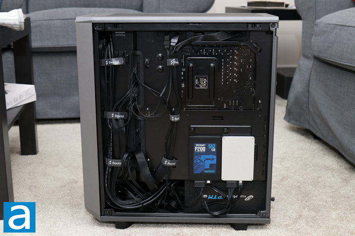 Image of the Noctua NH-D15 CPU cooler installed on the motherboard, showing its size and cooling fins, emphasizing efficient design.