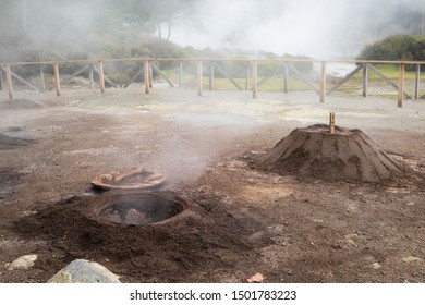 Pots of Cozido das Furnas being unearthed from the volcanic soil in Furnas, Azores.